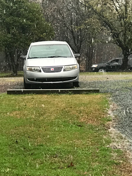 light snow falling on the car