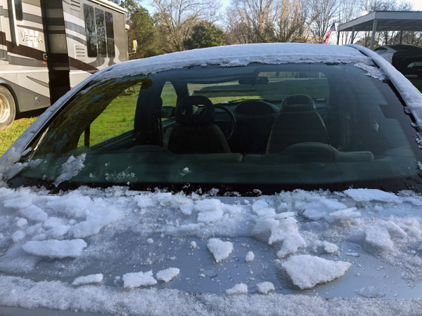 snow and ice chunks on the car