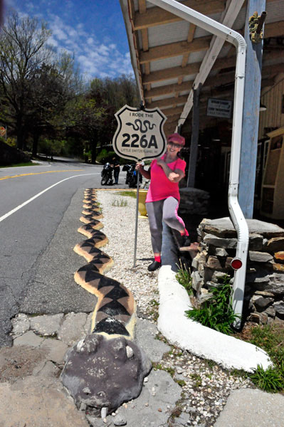 Karen Duquette with the snake road 226a sign