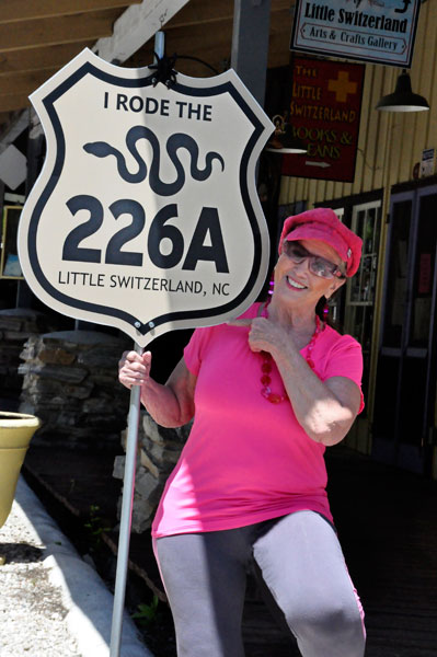 Karen Duquette with the snake road 226a sign