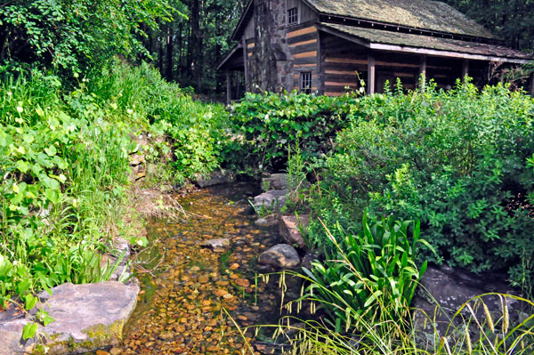 Water flowing from the waterfall towards the Hunt House