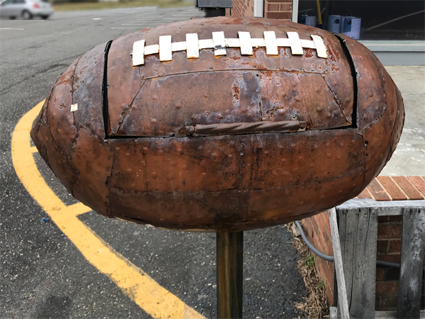 A football shaped grill