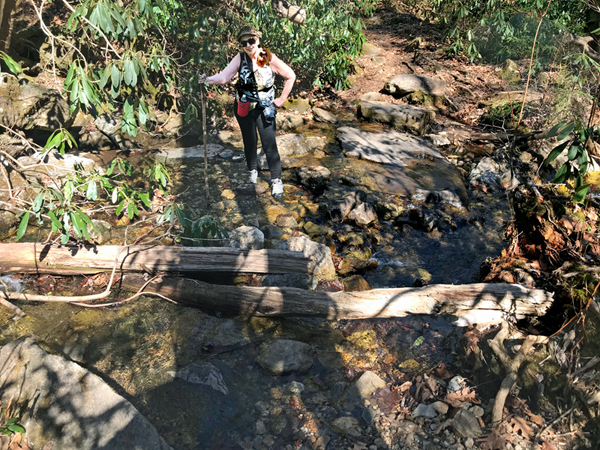 Karen Duquette crossing the stream