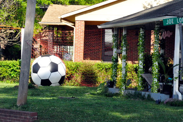 A big soccer ball in someone's yard