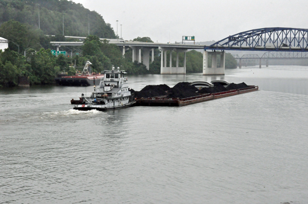 tug pushing a load of coa