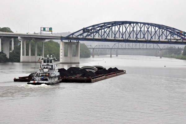 tug pushing a load of coa