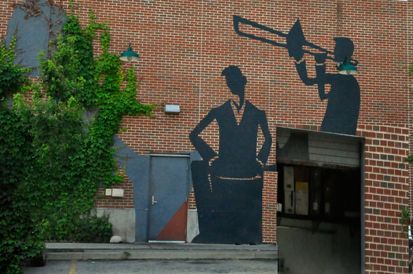 mural on the wall in a downtown parking lot