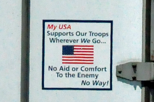 Sign on the back of a Semi-Truck