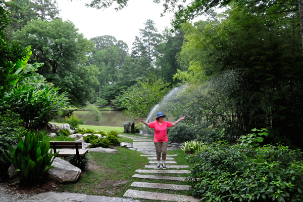 Karen Duquette in the sprinkler