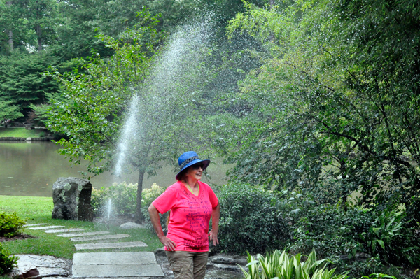 Karen Duquette in the sprinkler