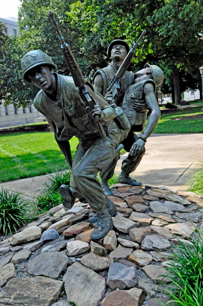 two soldiers carrying a wounded comrade