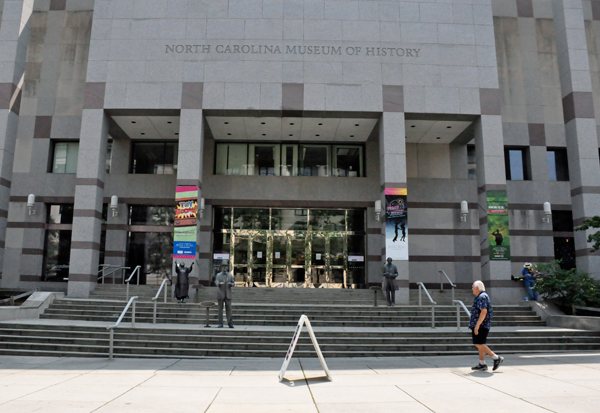 the North Carolina Museum of History and 3 statues