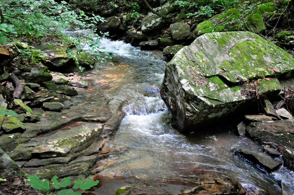 a big rock in the water