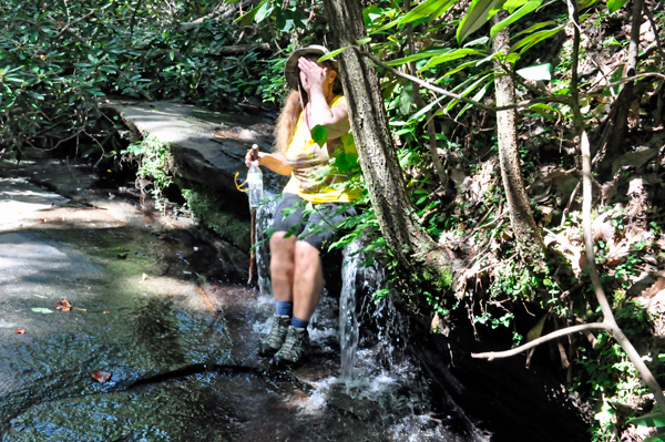 Karen Duquette splashing water on her face