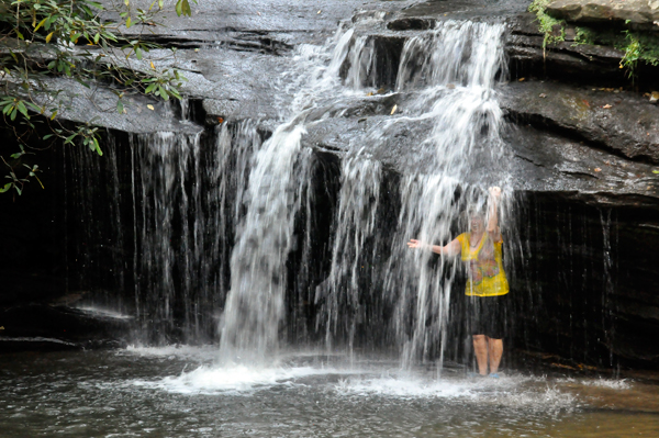 Karen Duquette behind the waterfall