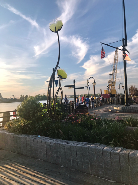 A really tall blown glass flower tree.