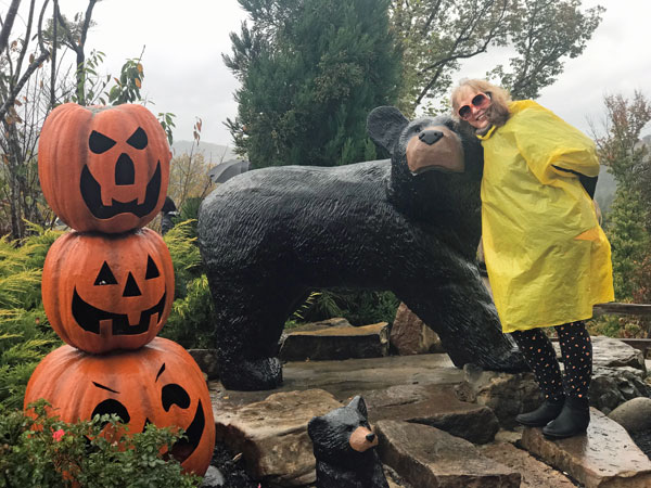 Karen Duquette hugs a bear