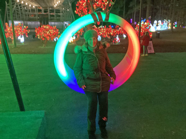 aren Duquette on a lighted swing