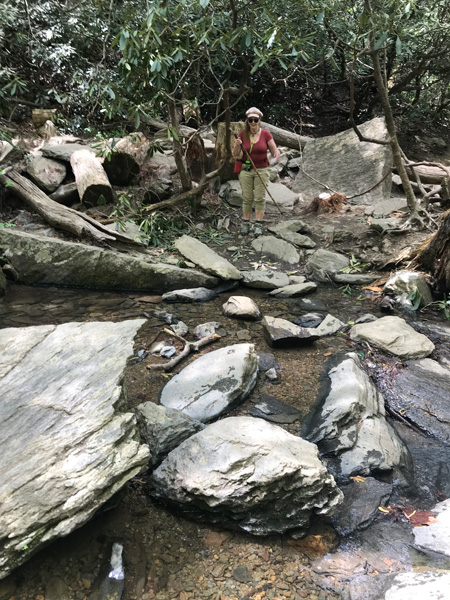 Karen Duquette crossing the rocks