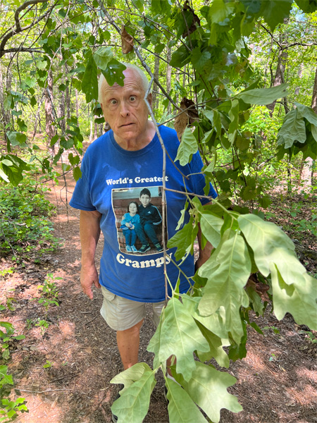 Lee Duquette and drooping branches on the trail