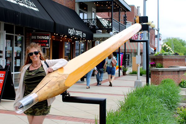 Karen Duquette and a large pencil