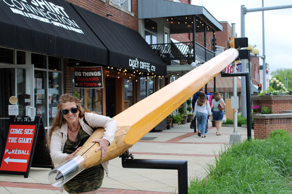 Karen Duquette and a large pencil