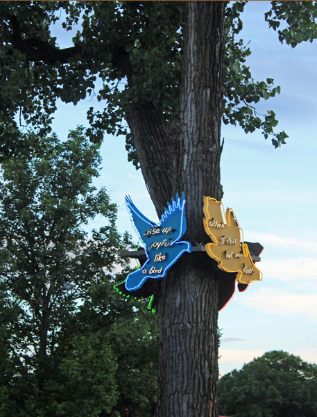 glowing neon signs on a tree