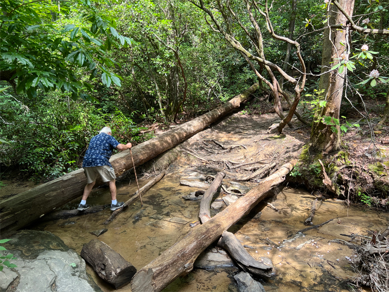 Lee Duquette making his way across another creek crossing