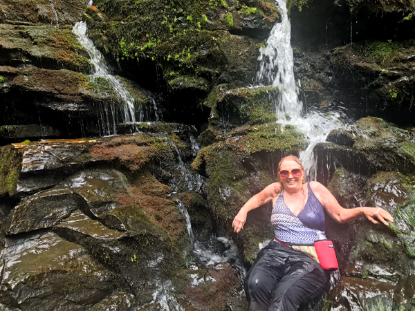 Karen Duquette under the waterfall