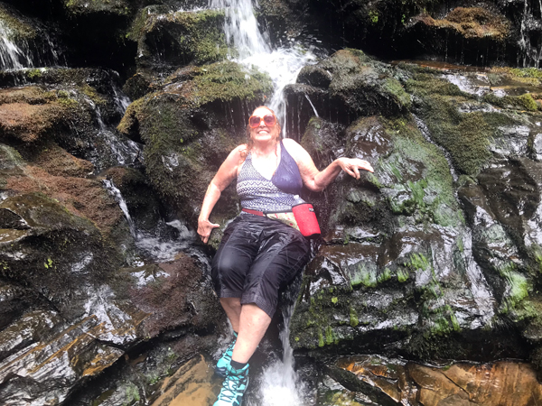 Karen Duquette under the waterfall