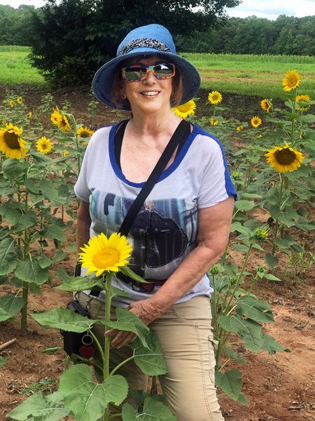 Karen Duquette and a sunflower