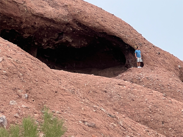 a man near the edge of the hole