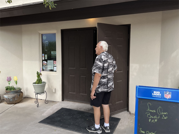 Lee Duquette entering Gold Stallion Restaurant