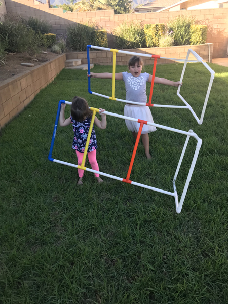 JJ and Emily playing in the yard