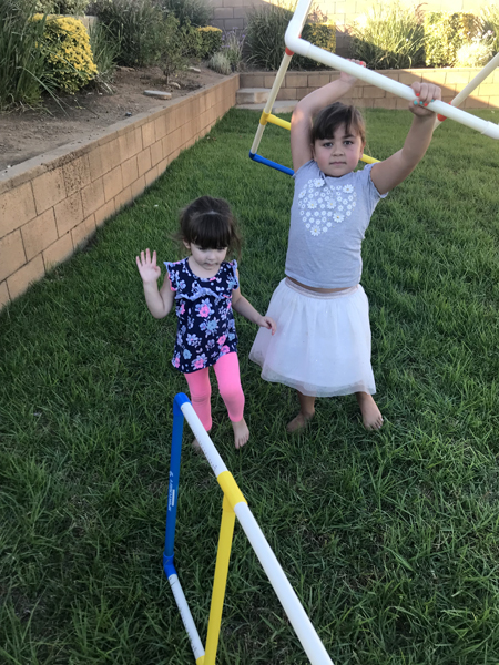 JJ and Emily playing in the yard
