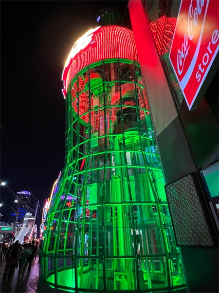 large Coca-Cola bottle at night