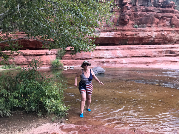 Karen Duquette walking in the water