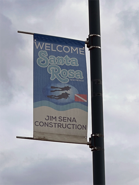 Welcome to Santa Rosa sign with scuba divers
