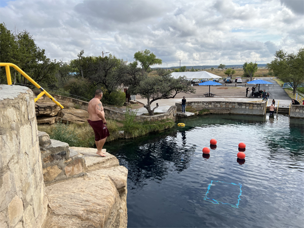 someone diving from the big rock 