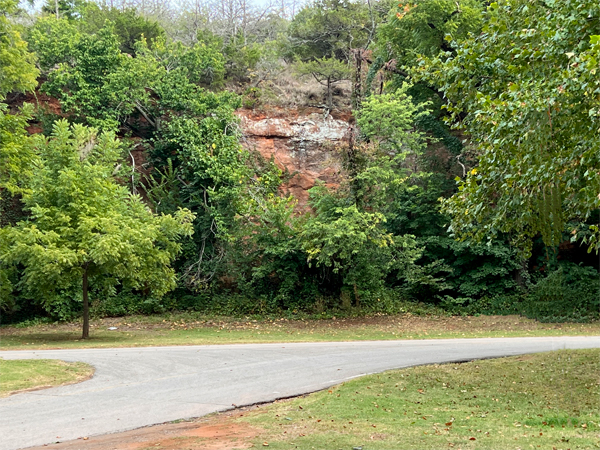 big red rock in front of the RV