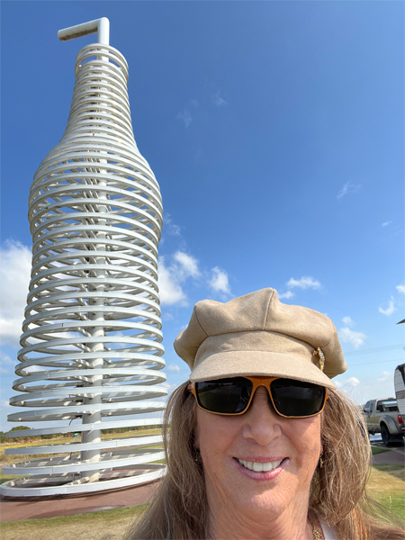 a large soda bottle and straw and Karen Duquette