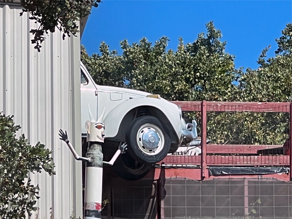 car hanging out of the building 