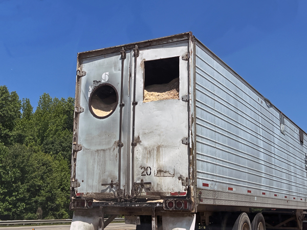 truck dropping sand on the highwa