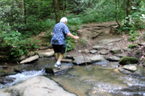 Lee Duquette crossing the small stream