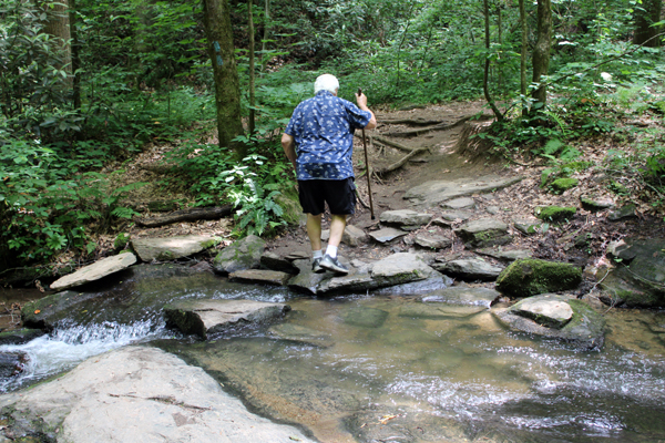 Lee Duquette crossing the small stream
