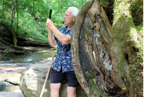 Lee Duquette by a big burl on a tree