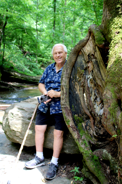 Lee Duquette by a big burl on a tree