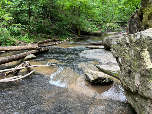 The bottom of the falls as the water flows on