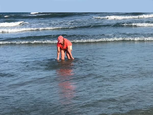 Karen Duquette playing im the oceacn at Sunset Beach