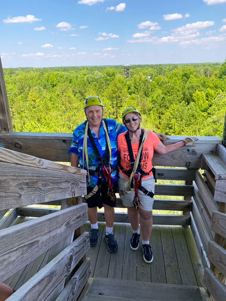 the two RV Gypsies in zipline gear